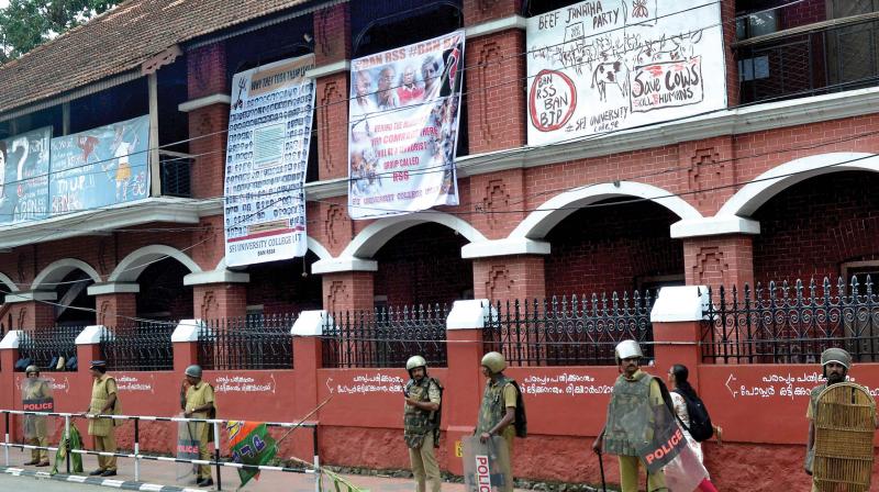 Ant-RSS, anti-BJP flex boards erected by left  organisations on the walls of University College along the route of Janaraksha Yatra on Tuesday. (Photo: DC)