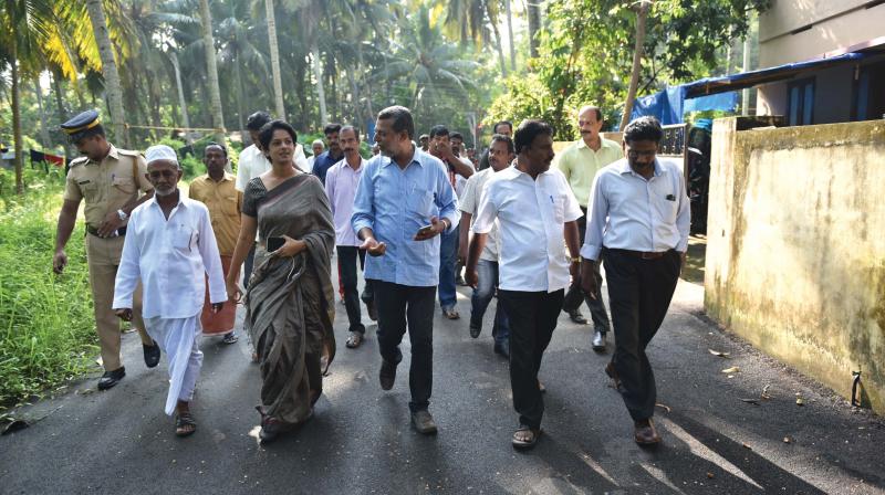 District collector K. Vasuki, accompanied by revenue officials and local residents, visits areas of Vayyamoola identified to be acquired for airport expansion.