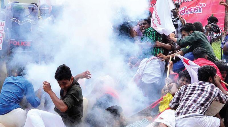 Police uses tear gas after a students march turned violent in Kozhikode. 	 DC FILE