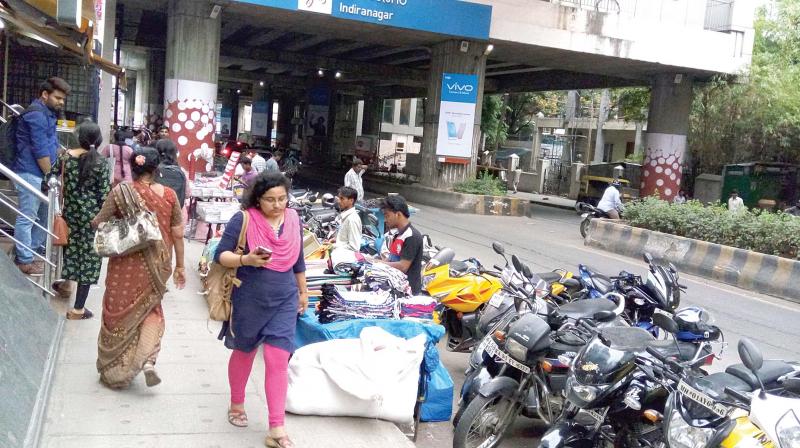 Stalls and street hawkers choke the footpaths near  Indiranagar metro station making it a difficult task for pedestrians to walk.