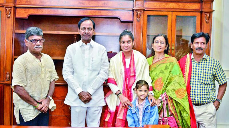 Mithali, her parents and coach RSR Murthy (right) pose after meeting Chief Minister KCR in Hyderabad on Friday.