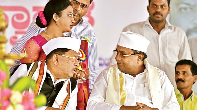 Chief Minister Siddaramaiah and KPCC president Dr G. Parameshwar at an event in Kodagu on Tuesday. (Photo: DC)