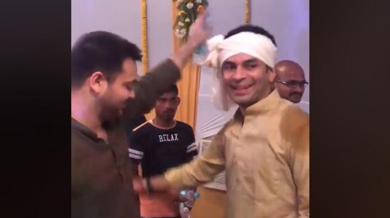 Tejashwi Yadav has shared a video of him dancing with brother and groom Tej Pratap Yadav. (Photo: ANI | Screengrab)