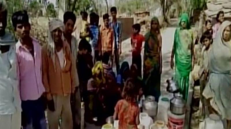 Panchayat Head Rajesh Prajapati blamed it on the policies of the state government and cited the dropped water levels in the area as two reasons for acute water shortage. (Photo: Twitter | ANI)