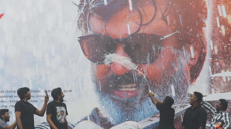 As ever, Rajini fans were elated with the release of a new film. At Albert Theatre, they perform the milk abhishekam with which they invariably greets their Thalaivar. (Photo: E.K. Sanjay)