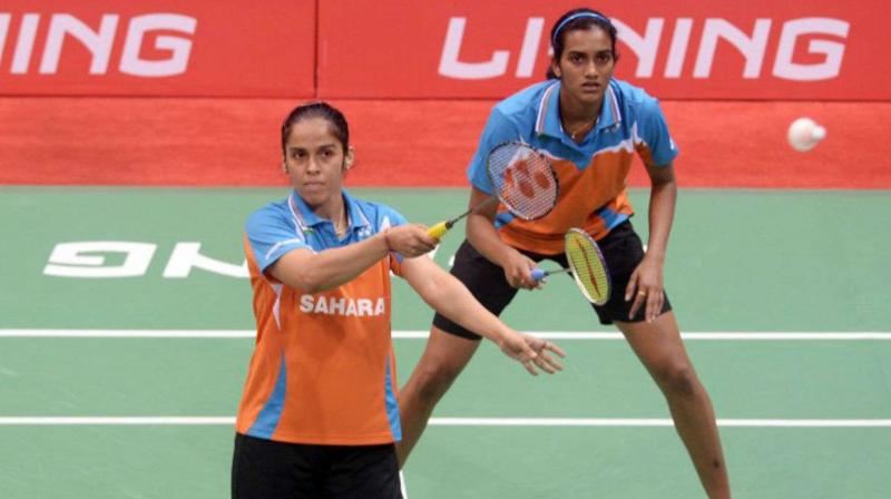 i: Fierce rivals on court, badminton stars Saina Nehwal and P V Sindhu are training at separate academies of national coach Pullela Gopichand ever since their epic Commonwealth Games summit clash in Gold Coast, eager to ensure that neither of them gets a whiff of the others strategies and improvisations. (Photo: AFP)