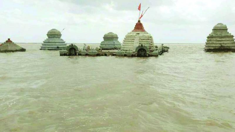 Sri Lalitha Sangameshwara temple submerged in the backwaters of Srisailam project on Monday.