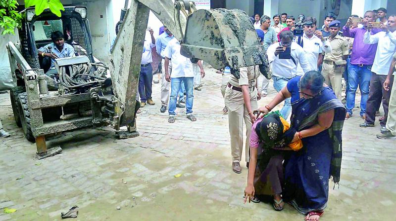 An eyewitness shows the spot where a girl was allegedly beaten and killed by a staff member at a state-funded shelter home, in Muzaffarpur district on Monday. 	 PTI