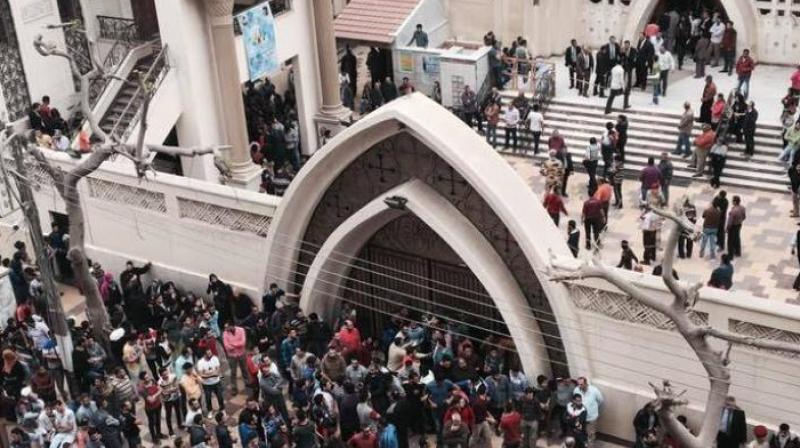 Relatives and onlookers gather outside a church after a bomb attack in the Nile Delta town of Tanta, Egypt. (Photo: AP)