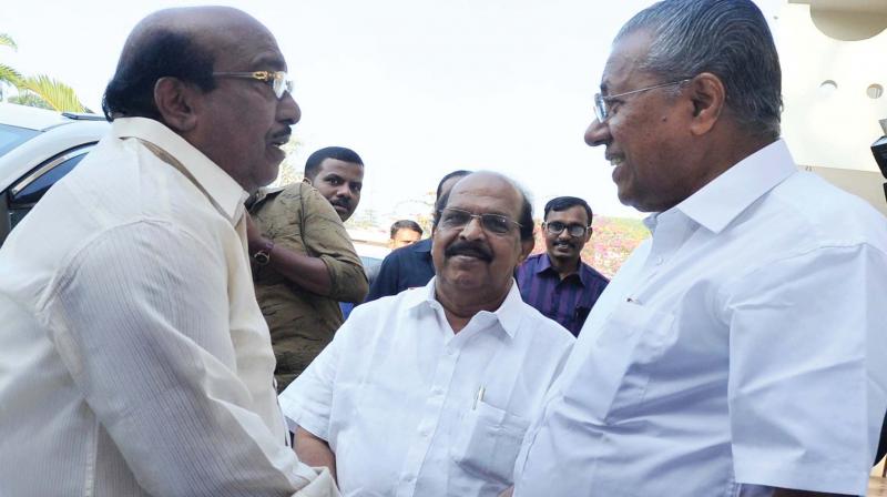 SNDP Yogam general secretary Vellappally Natesan welcomes CM Pinarayi Vijayan to his residence in Cherthala on Monday. PWD minister G. Sudhakaran looks on. (Photo: DC)