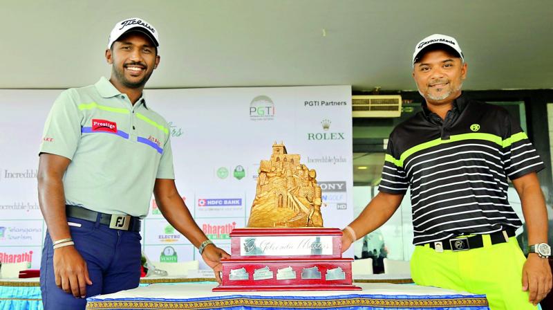 Golfers Chikkarangappa (left) and  Rahil Gangjee (right) pose with the Golconda Masters trophy.