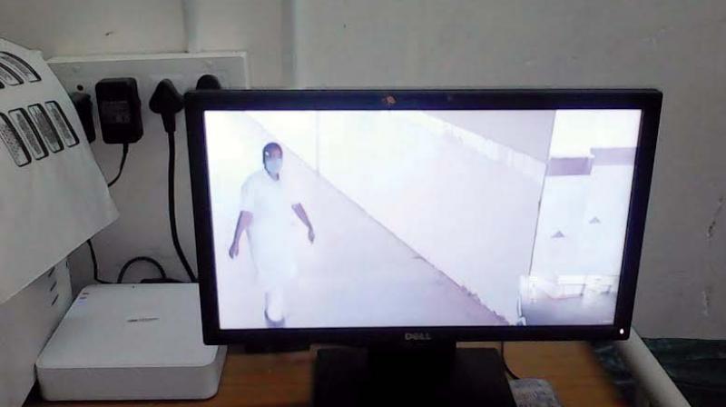 CCTV grab of the imposter clad in nurses attire