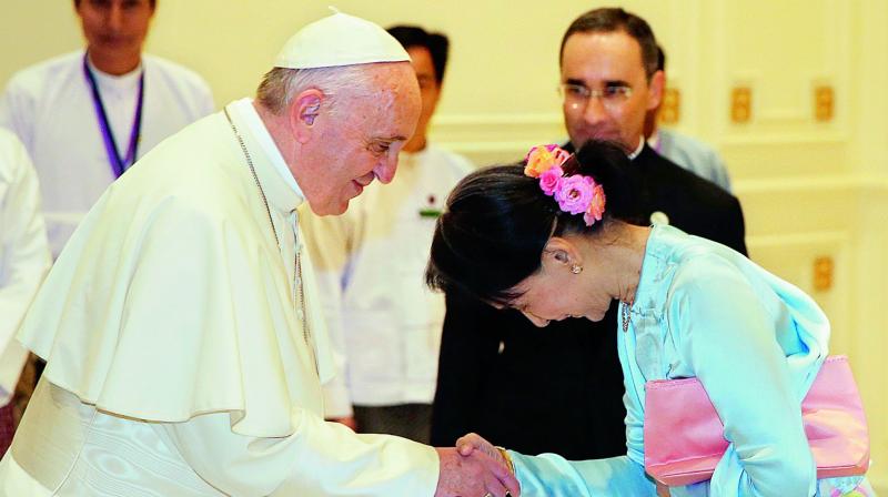 Pope Francis shakes hands with Myanmars leader Aung San Suu Kyi in Naypyitaw, Myanmar, on Tuesday. (Photo: AP)