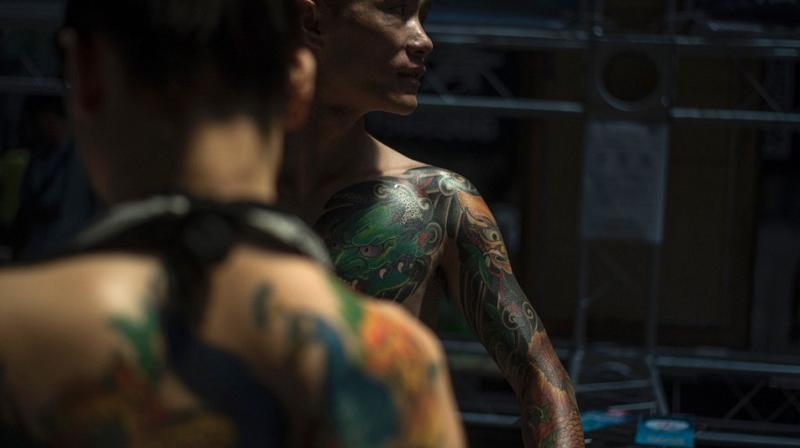 One in five adults in the UK now have tattoos (Photo: AFP)