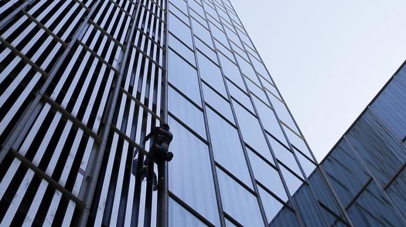 The free climber has scaled the worlds tallest structures, almost always without ropes or harnesses and often without permission. (Photo: AP)