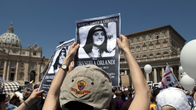 In this May 27, 2012, file photo, demonstrators hold pictures of Emanuela Orlandi reading \march for truth and justice for Emanuela\ during Pope Benedict XVIs Regina Coeli prayer in St. Peters square, at the Vatican. (Photo: AP)