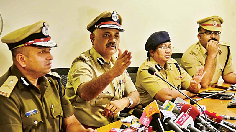 Bengaluru Police Commissioner Praveen Sood and other police officers address the media in Bengaluru on Thursday. (Photo: R. Samuel)