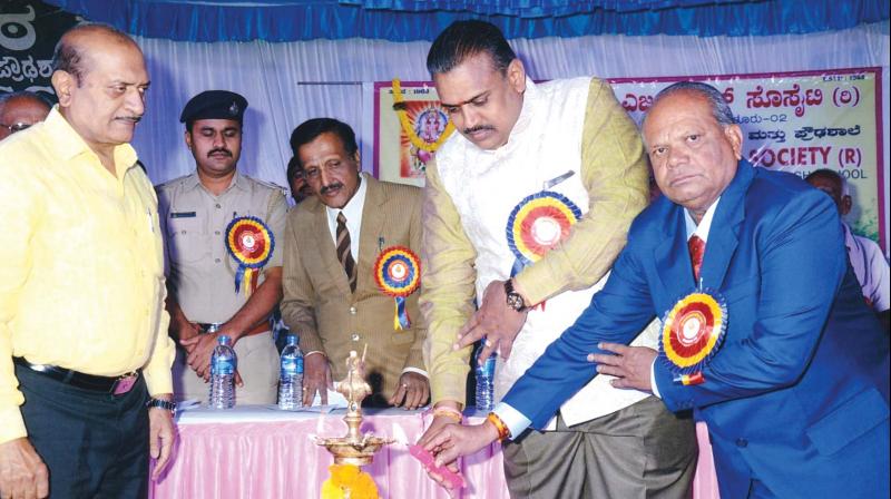 M. Lakshminarayana, president, and Srinivasamurthy, Secretary, Vinayaka Education Society, Cubbon Park, inaugurate societys 54th anniversary in Bengaluru.