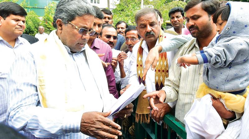 Chief Minister  Siddaramaiah hears public grivences at his home office Krishna in Bengaluru on Friday. (Photo: DC)