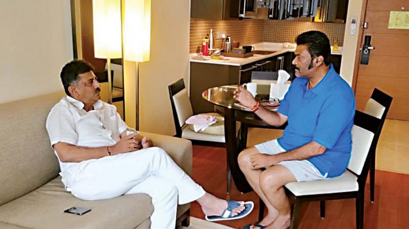 A file photo of Congress leader DK Shivakumar with  Vijayanagar MLA Anand Singh at Hilton hotel in Bengaluru