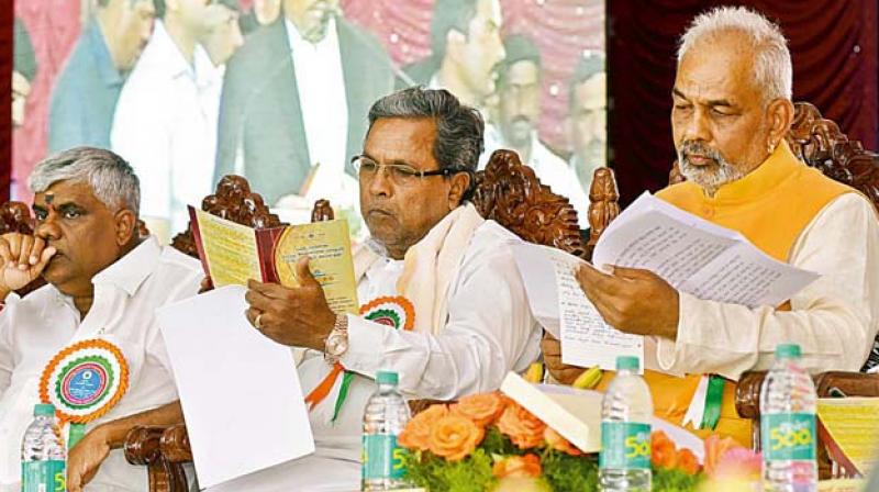 Siddaramaiah (centre) with A. Manju in a file photo