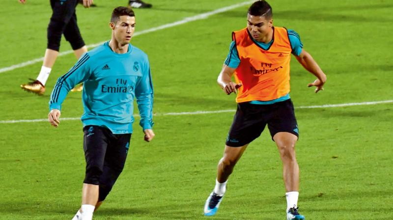 Real Madrids Cristiano Ronaldo (left) at a training session in Abu Dhabi on Tuesday, the eve of his teams Fifa Club World Cup semi-final against Al Jazira (Photo: AFP)