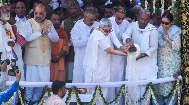 Former prime minister Atal Bihari Vajpayees daughter Namita Kaul Bhattacharya and son-in-law Ranjan Bhattacharya immerse his ashes in the Ganga at Har ki Pauri, in Haridwar on Sunday. (Photo: PTI)