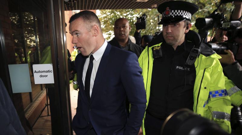 Wayne Rooney has been banned from driving for two years after pleading guilty to drunk driving. (Photo: AP)