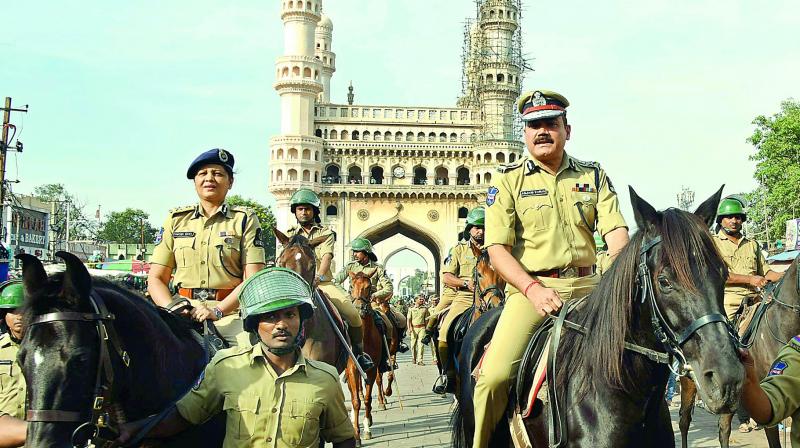 City Police Commissioner Anjani Kumar and Additional CP Crimes Shikha Goel IPS are seen leading a flag march in front of the historical Charminar on Sunday.  (Photo: Gandhi)