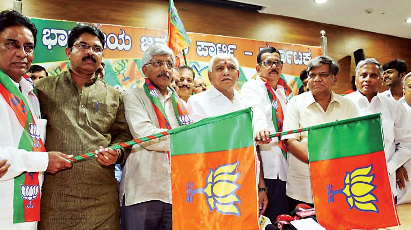 A file photo of BJP leader V. Somanna at a function to induct Congress leader Jayaprakash Hegde into BJP