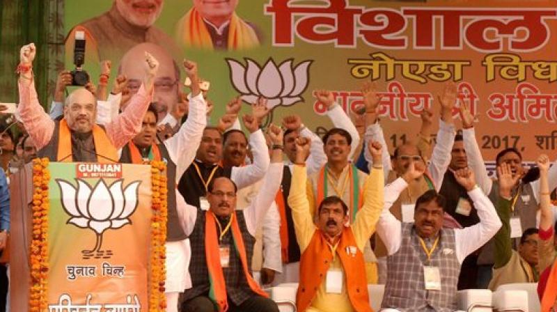 BJP National President Amit Shah with party leaders at an election rally. (Photo: PTI)