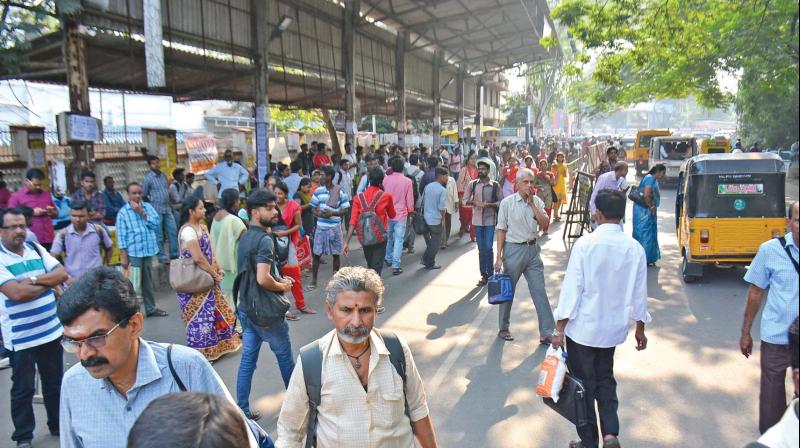 People wait at Gunidy bus depot on Friday. (Photo: DC)