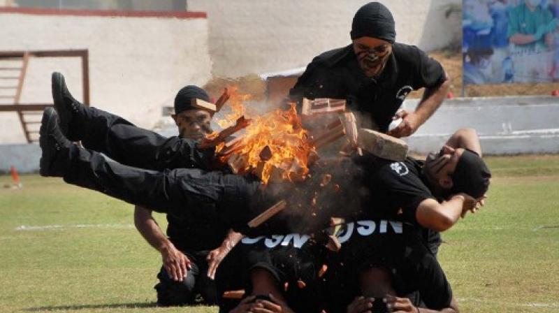 A file photo showing NSG Commandos show their skills on the Raising day commemoration of National Security Guard. (Photo: PTI)