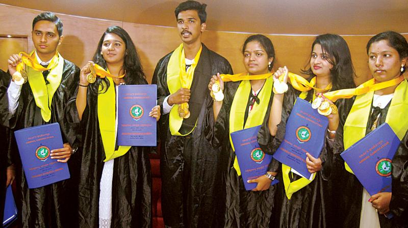 Medal winning students at VTU convocation in Belagavi on Tuesday. (Photo: DC)