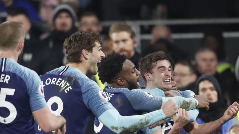ottenham needed a goal by Harry Winks in the third and final minute of injury time to earn a 2-1 victory at Fulham. (Photo: AP)