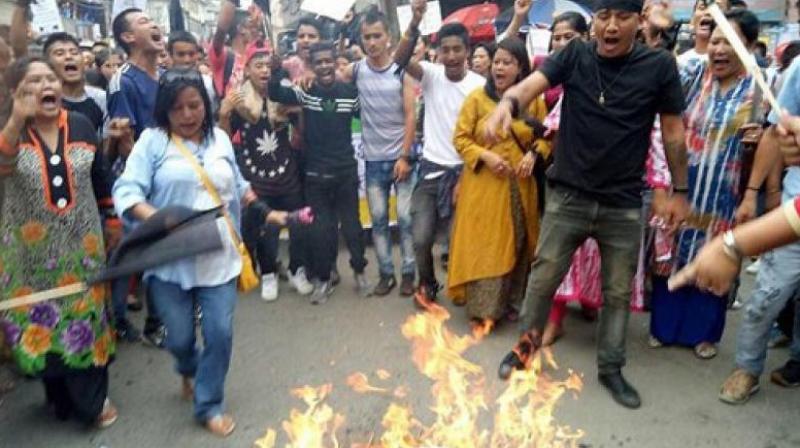 Gorkha Janmukti Morcha (GJM) supporters during their protest in Darjeeling on Thursday. (Photo: PTI)