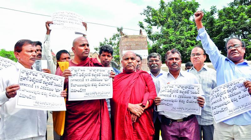 Buddhist monks, under the aegis of District Maha Bodhi Society, stage a protest against allocation of 15  acres to Film Nagar Centre at Thotlakonda in Vizag.