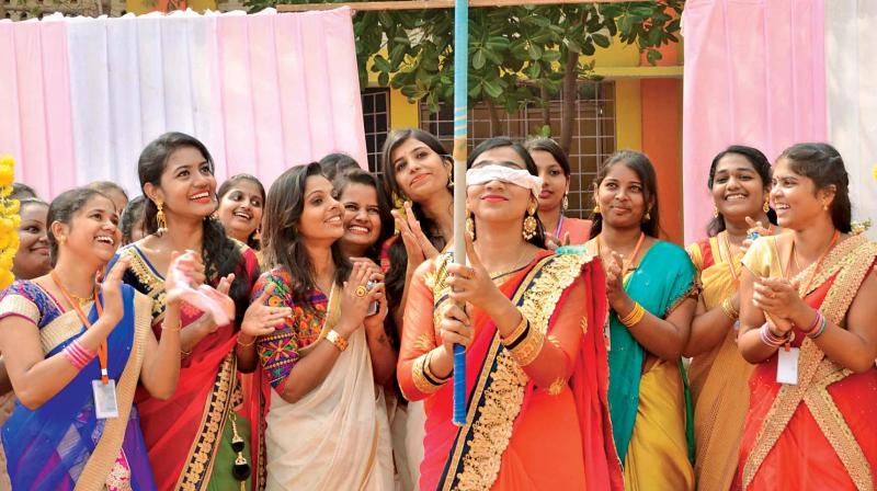 Students of  Sri Kanyaka Parameswari College for women  celebrate Pongal festival on Wednesday (Photo: DC)