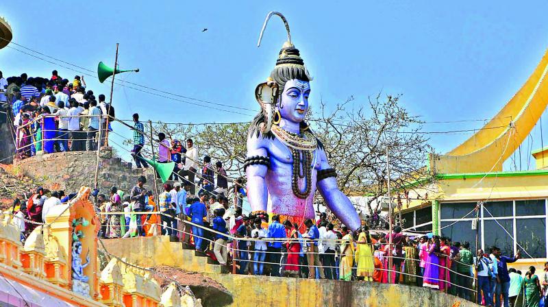 Devotees throng the hilltop Trikoteswara Swamy temple at Kotappakonda in Guntur district on Friday for a darshan to mark the Maha Sivaratri. (Photo: DC)