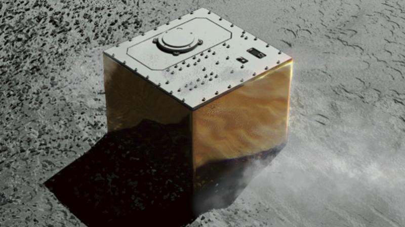 This computer graphic image provided by the Japan Aerospace Exploration Agency (JAXA) shows the Mobile Asteroid Surface Scout, or MASCOT, lander on the asteroid Ryugu. The Japanese unmanned spacecraft Hayabusa2 dropped the German-French observation device, MASCOT, on October 3, 2018, to land on the asteroid as part of a research effort intended to find clues to the origin of the solar system. (JAXA via AP)