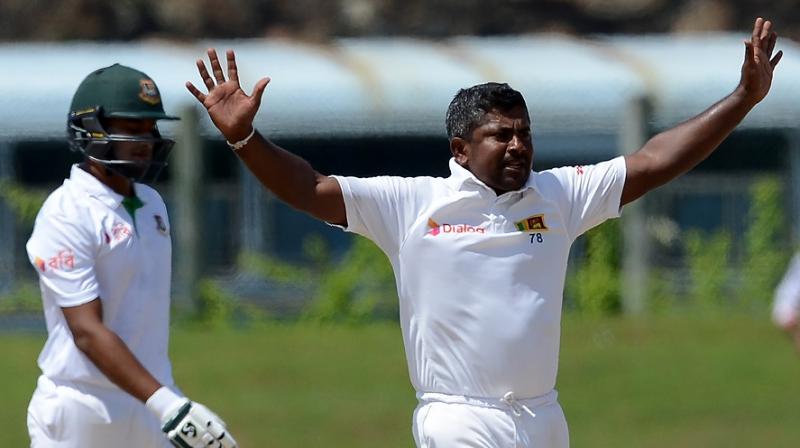 With figures of 6/59, the Rangana Herath ripped through the Bangladesh middle order and ensured the visitors dont have any chance of crossing the line. (Photo: AFP)