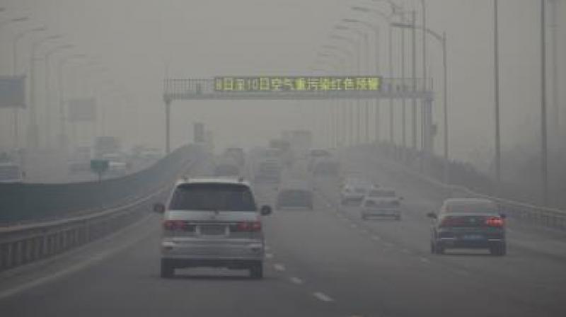 The smog is expected to disperse Sunday evening when a cold front is forecast to hit the city, according to the citys meteorological authorities. (Photo: AFP)