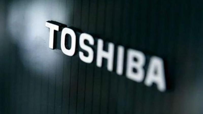 Toshiba shares traded 10.4 percent lower at 397.10 yen in morning trading, paring an earlier loss of as much as 16.3 percent.