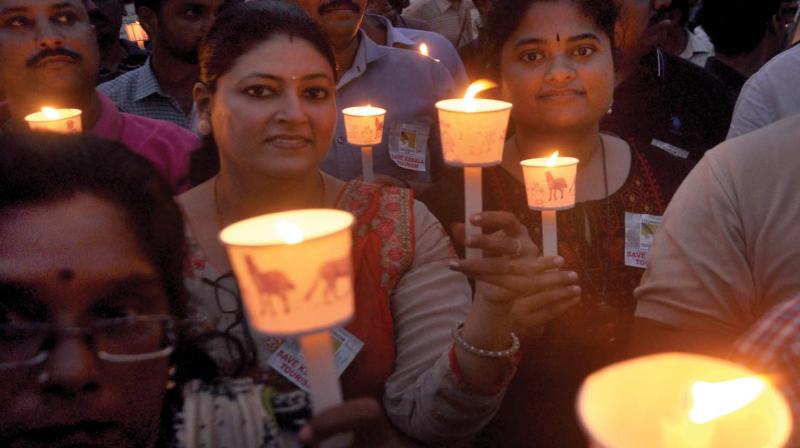 Members of Tourism Professionals Club take out a silent candle light march against the flash strikes hurting tourism industries, in Kochi on Tuesday.    (SUNOJ NINAN MATHEW)