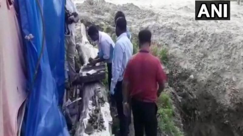 CBI officials, along with the Forensic Science Laboratory team, at the site where the skeleton was found in the districts Sikandarpur area. (Photo: ANI)