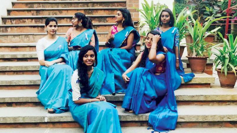 Students from St Josephs College, Department of Social Work posing in similar sarees at their farewell.