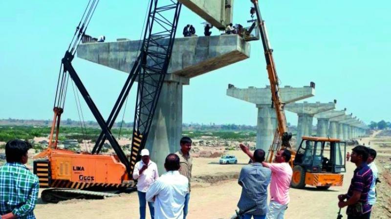 Construction of the inter-state bridge going on at Gudem in Kumarambheem Asifabad on Monday. (Photo: DC)