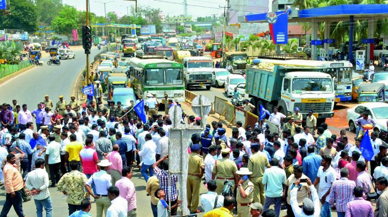 Dalits block the NH-16 at Lalacheruvu in Rajahmundry on Monday. (Photo: DC)