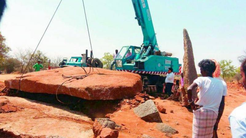 A large crane lifted the huge capstone at the excavation site in Narmeta village on March 21. (Photo: Facebook)