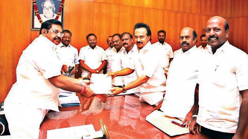 DMK working president M.K. Stalin gives a petition to rollback hike in bus fares to TN Chief Minister Edappadi K. Palaniswami at Secretariat on Tuesday (Photo: DC)